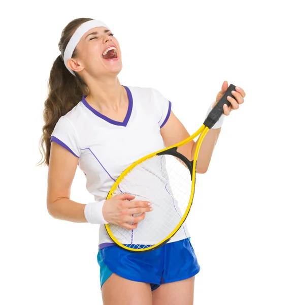 Happy female tennis player playing on racket as on guitar — Stock Photo, Image