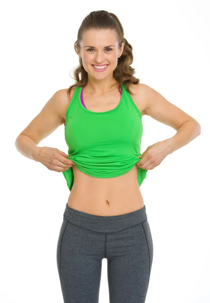 Šťastný fitness mladá žena zobrazeno ploché bříško — Stock fotografie