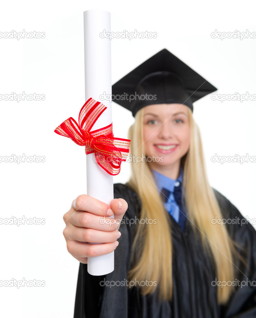 Closeup on diploma in hand of young woman in graduation gown
