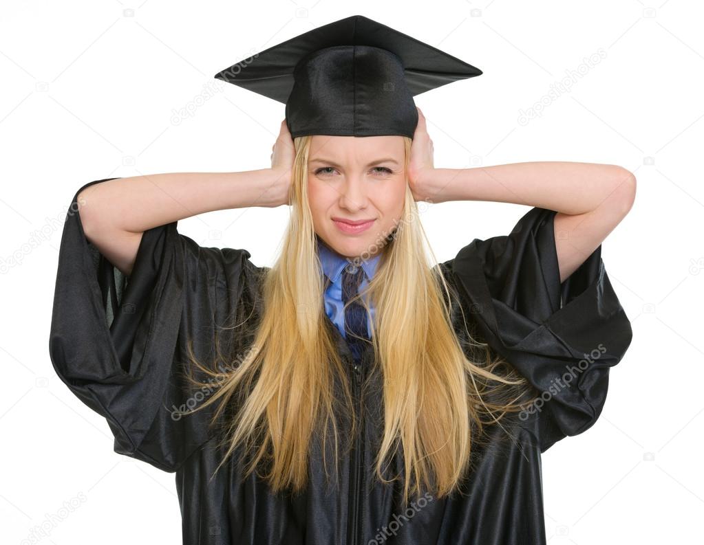 Frustrated young woman in graduation gown closing ears Stock Photo by  ©CITAlliance 25393225