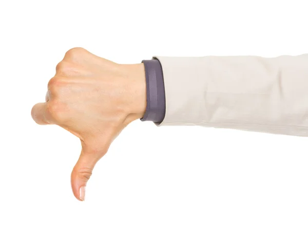 Closeup on hand of business woman showing thumbs down — Stock Photo, Image