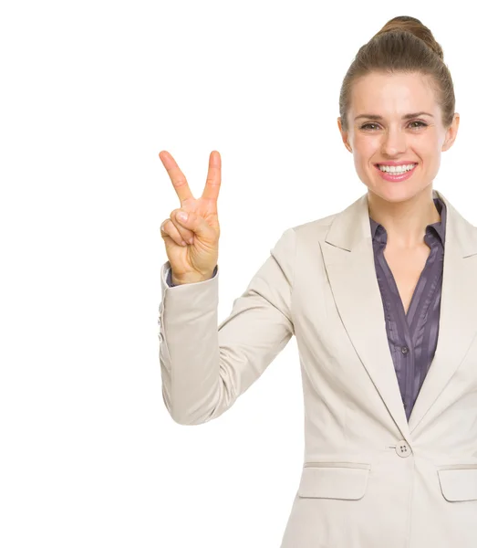 Happy business woman showing victory gesture — Stock Photo, Image