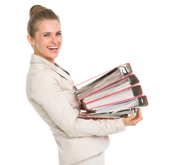 Happy business woman holding stack of folders — Stock Photo, Image