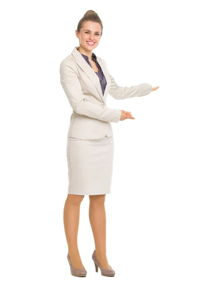 Happy business woman inviting to come Stock Image