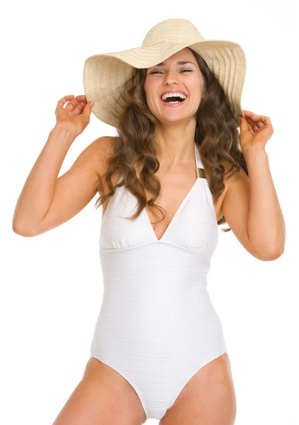 Portrait of smiling young woman in swimsuit and hat — Stock Photo, Image