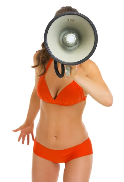 Woman in swimsuit shouting through megaphone — Stock Photo, Image