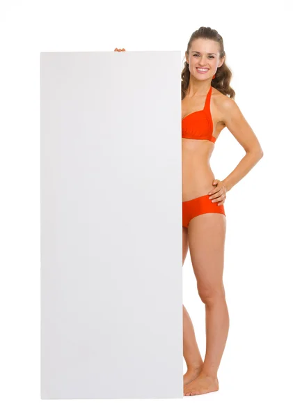 Full length portrait of happy young woman in swimsuit — Stock Photo, Image