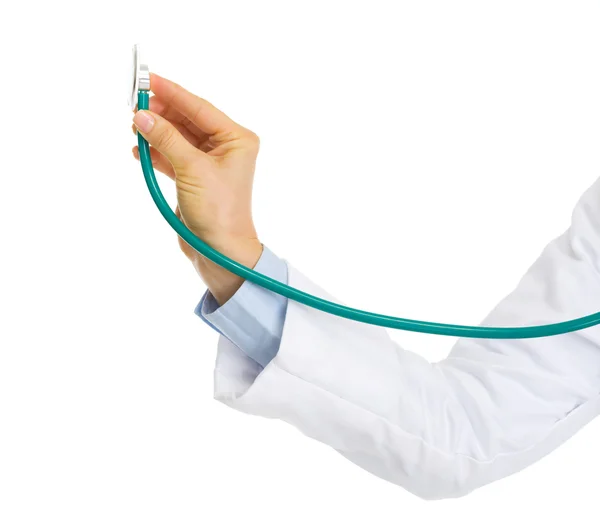 Closeup on doctor woman hand using stethoscope — Stock Photo, Image