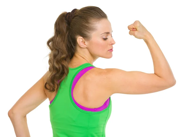 Fitness young woman showing biceps — Stock Photo, Image