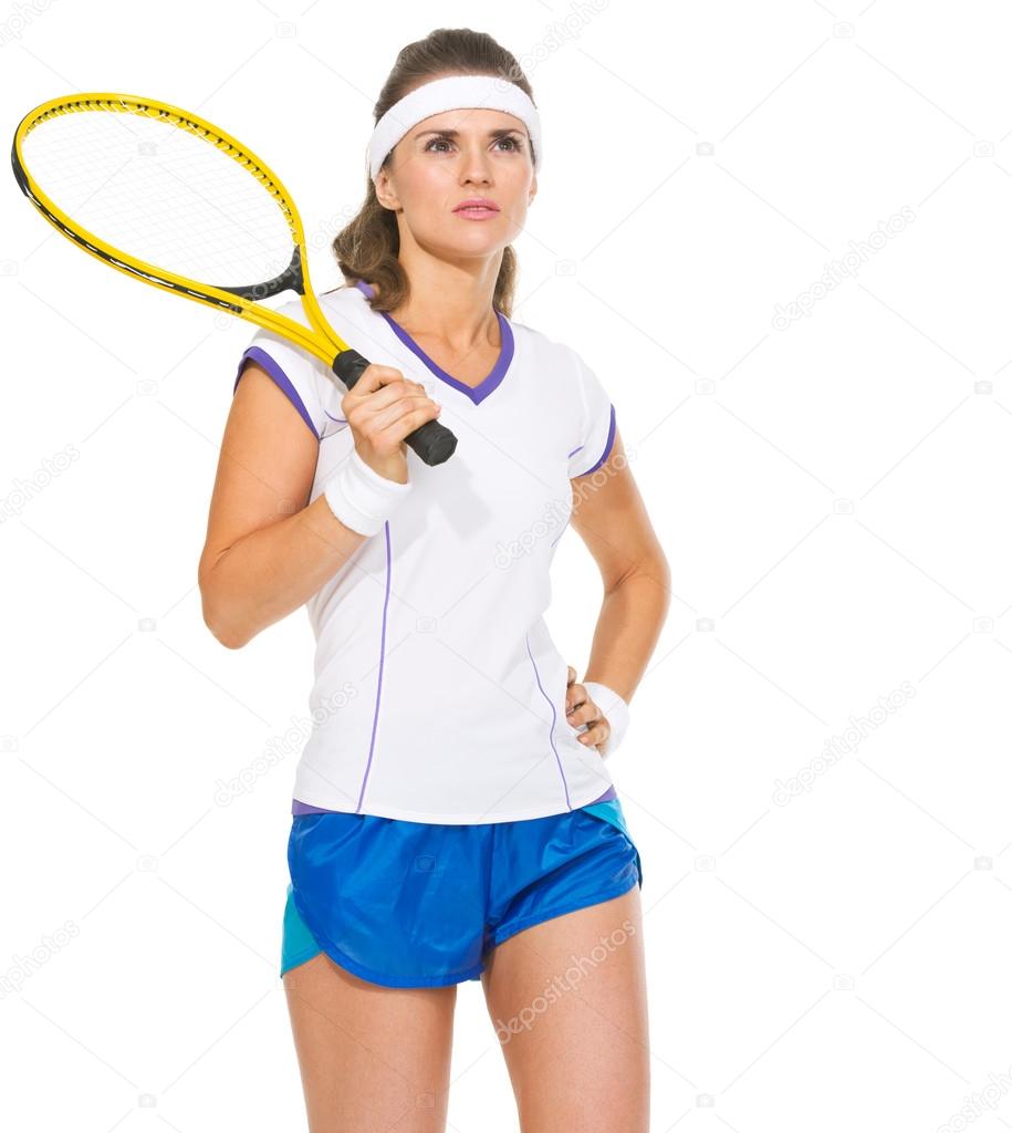 Portrait of confident female tennis player