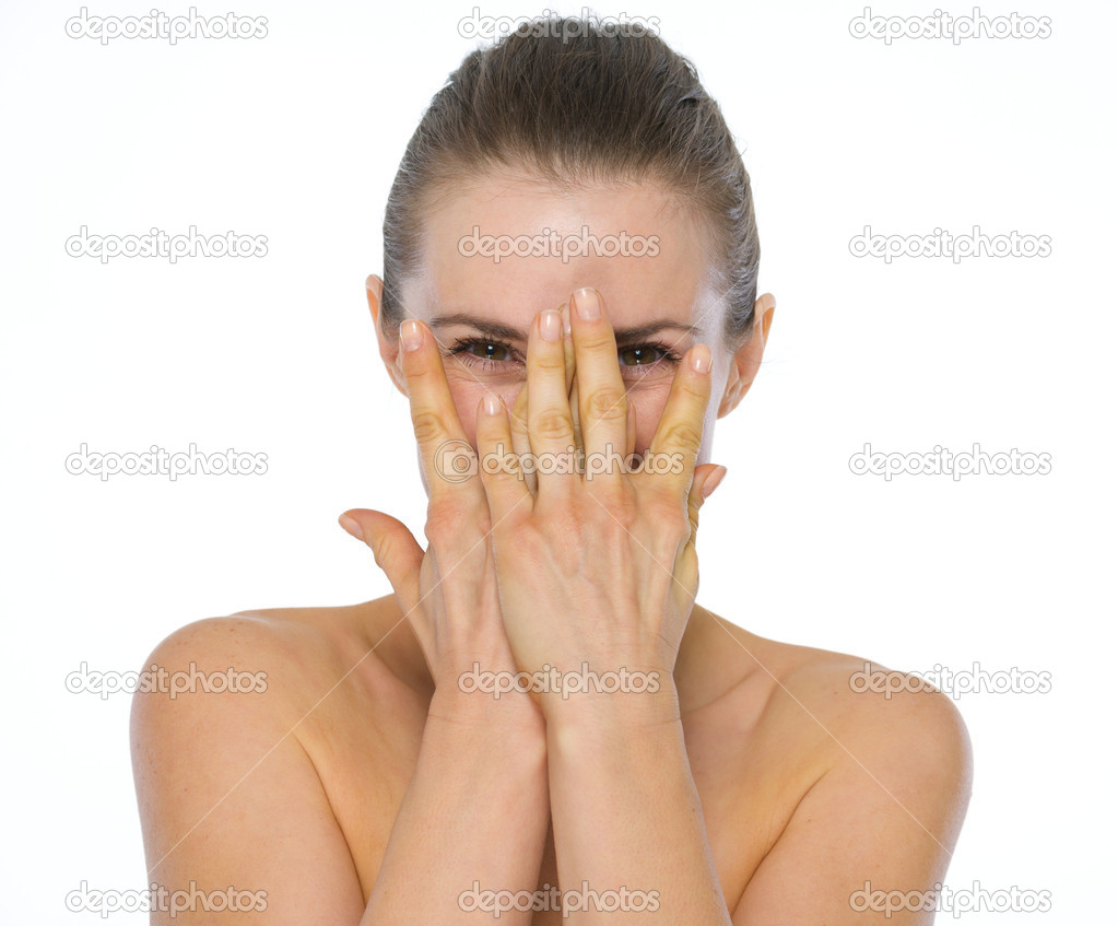 Beauty portrait of young woman hiding behind hands