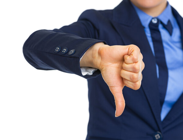 Closeup on business woman showing thumbs down