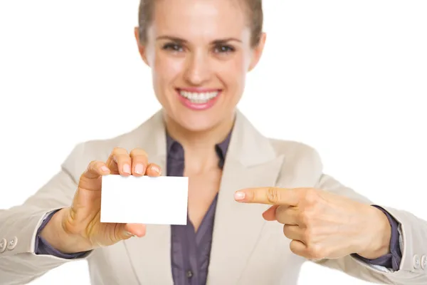 Closeup on smiling business woman pointing on business card — Stock Photo, Image