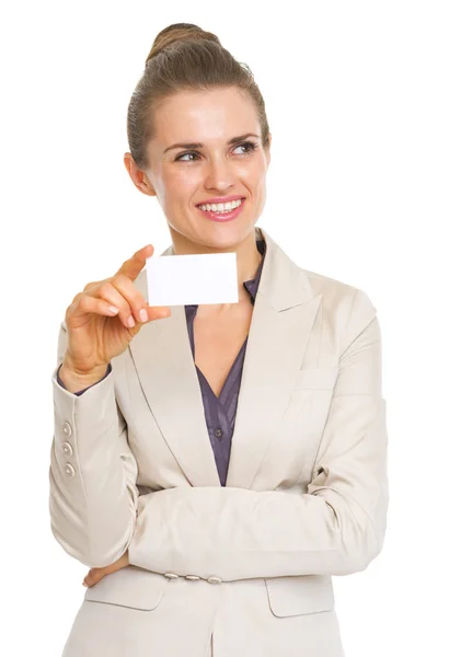 Thoughtful business woman holding business card — Stock Photo, Image