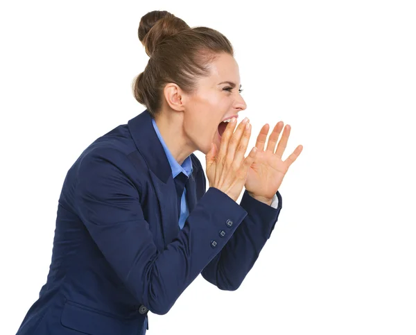 Business woman shouting through megaphone shaped hands — Stock Photo, Image