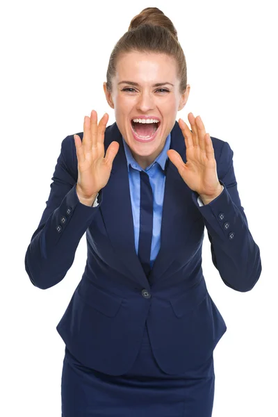 Happy business woman shouting through megaphone shaped hands — Stock Photo, Image