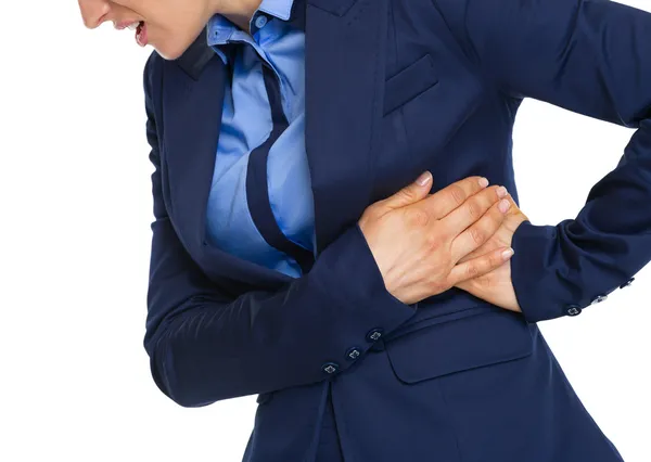 Closeup on business woman having heart pain — Stock Photo, Image