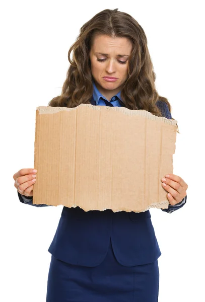 Upset business woman showing blank cardboard — Stock Photo, Image