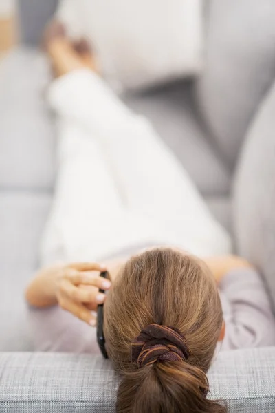 Young woman talking cell phone . rear view — Stock Photo, Image