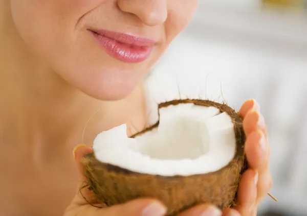Closeup on young woman enjoying coconut — Stock Photo, Image