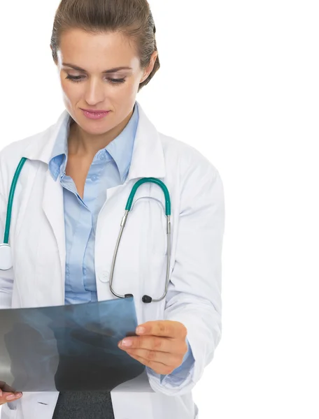 Thoughtful doctor woman checking fluorography — Stock Photo, Image