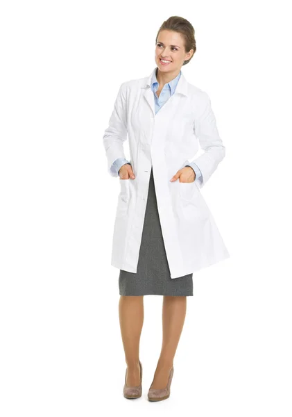 Full length portrait of woman in white robe looking on copy spac — Stock Photo, Image