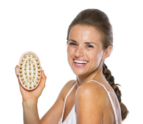 Lachende jonge vrouw tonen massager — Stockfoto