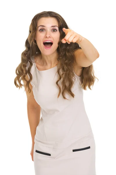 Surprised young woman pointing in camera — Stock Photo, Image