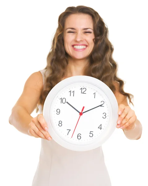 Closeup on clock in hand of smiling young woman — Stock Photo, Image