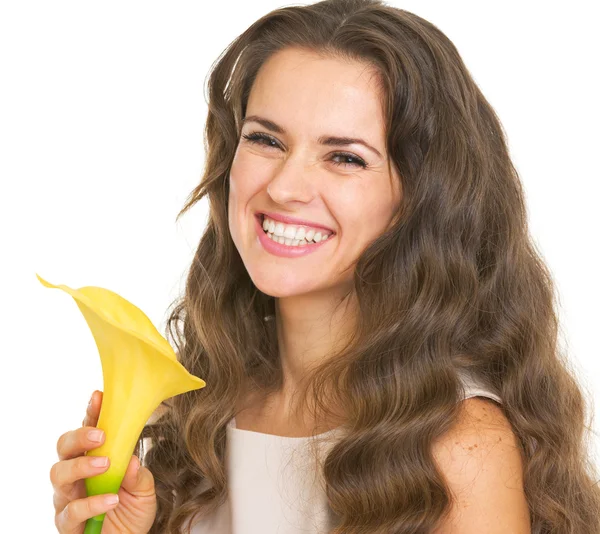 Portrait of smiling young woman with kala flower — Stock Photo, Image