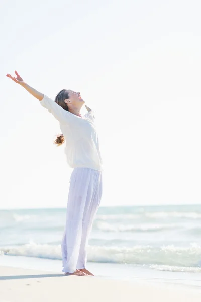 Happy young woman rejoicing at seaside — Stock Photo, Image