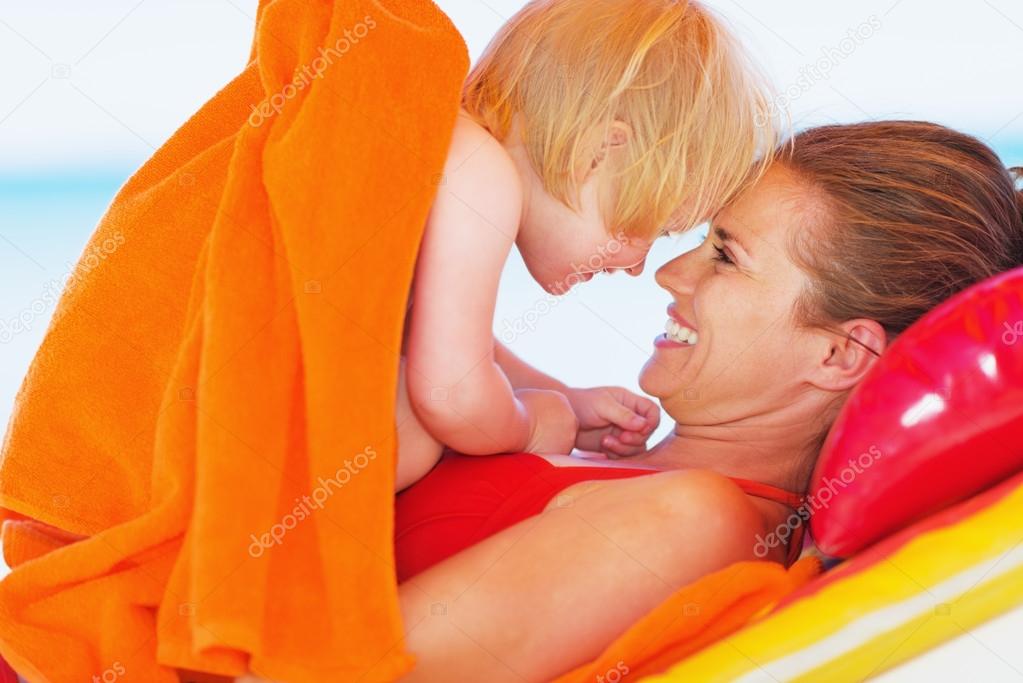 Portrait of happy mother and baby enjoying vacation