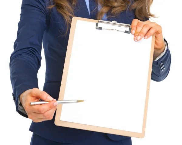 Closeup on business woman giving clipboard for sign — Stock Photo, Image