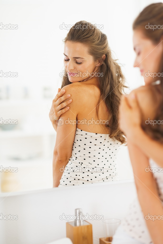 Young woman in bathroom
