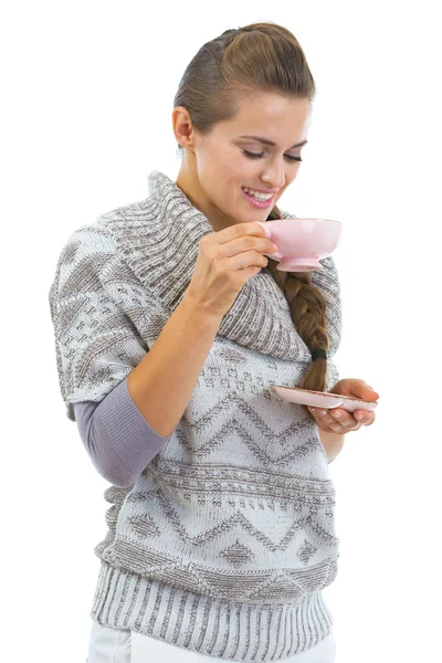 Young woman in sweater with cup of hot beverage — Stock Photo, Image