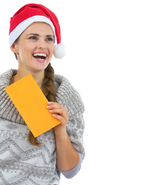 Young woman in sweater and christmas hat Royalty Free Stock Images