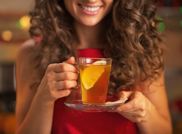 Closeup on happy young woman with cup of ginger tea — Stock Photo, Image