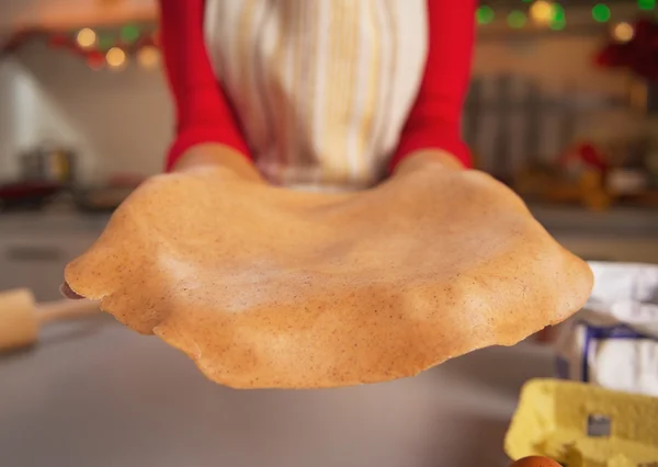 Closeup on dough in hand of young housewife — Stock Photo, Image