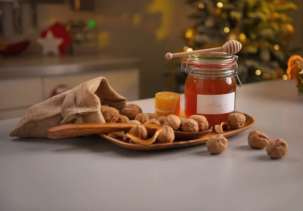 Honey and walnuts on table — Stock Photo, Image