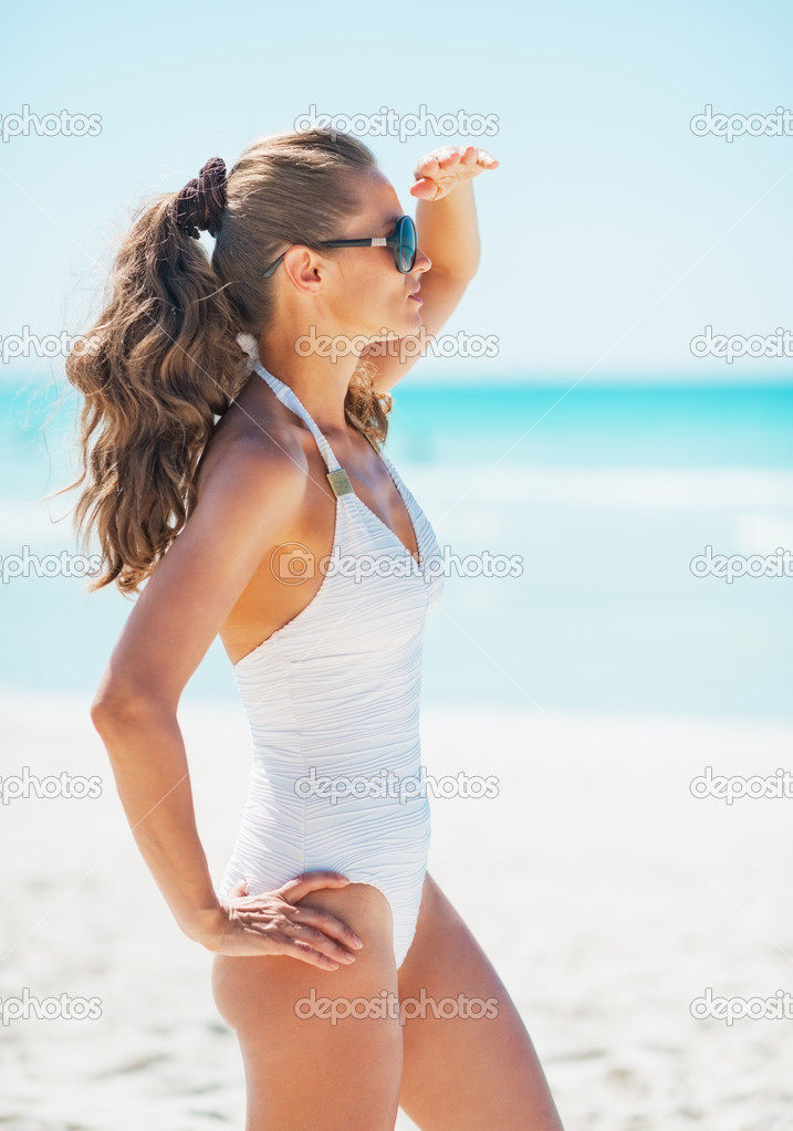 Young woman in swimsuit and sunglasses