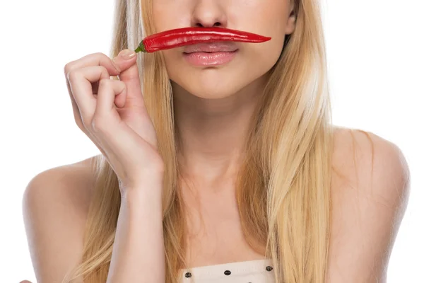 Closeup on young woman with red chili pepper — Stock Photo, Image