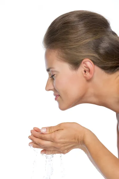 Young woman washing face — Stock Photo, Image