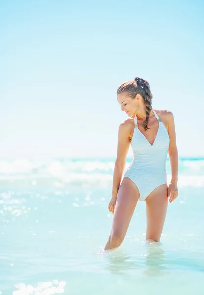 Full length portrait of young woman standing in sea — Stock Photo, Image