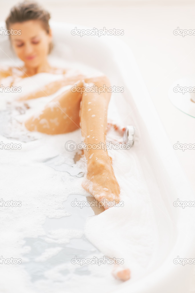 Closeup on young woman relaxing in bathtub