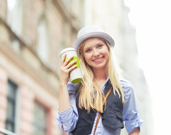 Hipster with cup of hot beverage — Stock Photo, Image