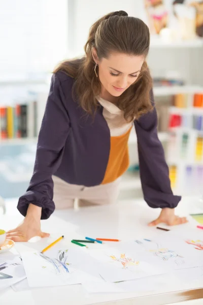 Happy fashion designer at work — Stock Photo, Image