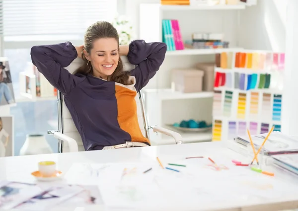 Relaxed fashion designer in office — Stock Photo, Image