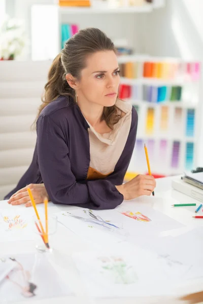 Thoughtful fashion designer in office — Stock Photo, Image