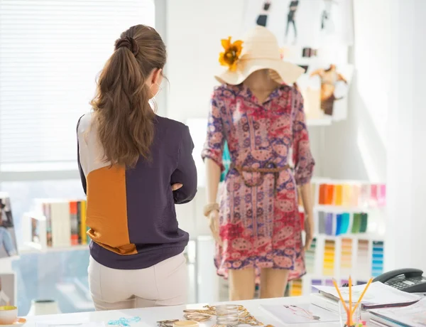 Fashion designer looking on garment — Stockfoto