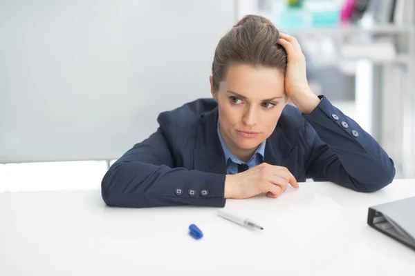 Stressed business woman near flipchart — Stock Photo, Image